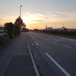 Road against sky at sunset