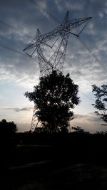 Low angle view of power lines against sky