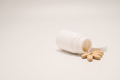 Close-up of pills against white background