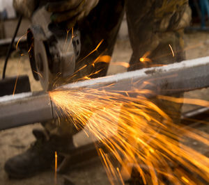 Low section of man working in factory