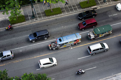 High angle view of vehicles on road in city