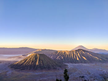 View of volcanic mountains against sky