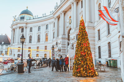 Group of people on christmas tree in city