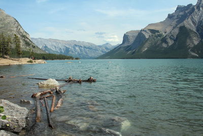 Scenic view of lake and mountains against sky