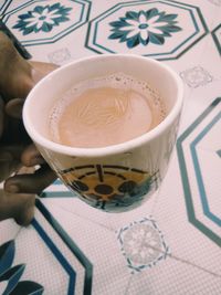 High angle view of coffee cup on table