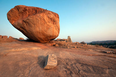 Rock formation on land against sky