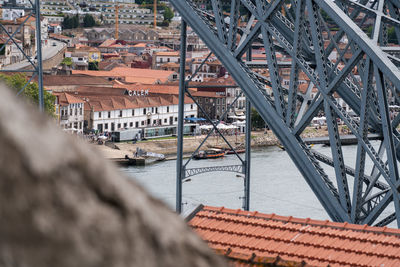 High angle view of bridge over river amidst buildings in city