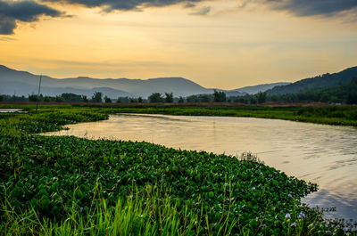 Scenic view of landscape against sky during sunset