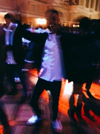 Group of people at illuminated nightclub