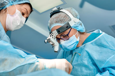 Surgeons doing surgery at hospital