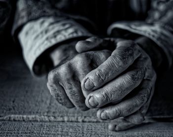 Cropped hands at table