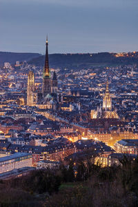 High angle view of illuminated buildings in city