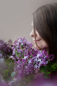 Portrait of woman with pink flower