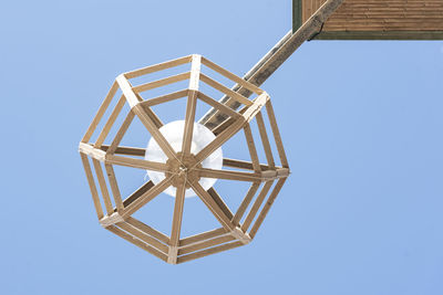 Low angle view of spiral staircase against clear blue sky