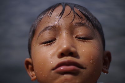 Sad little boy at ranau lake.