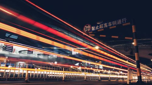 Light trails on road in city at night