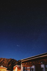 Low angle view of building against sky at night