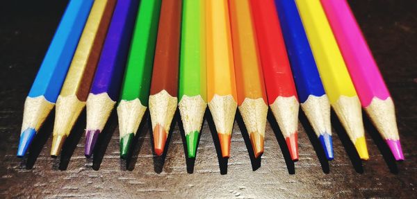 Close-up of colored pencils on table