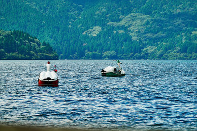 People in boat at a lake