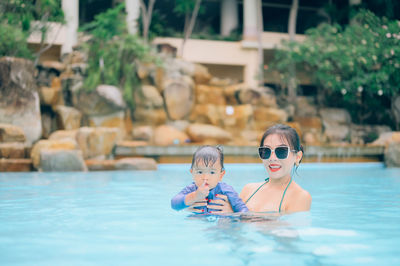 Portrait of children in swimming pool