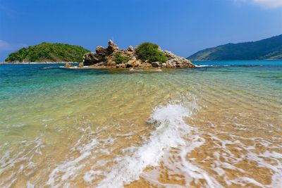 Scenic view of sea against blue sky