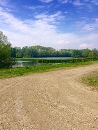 Scenic view of landscape against cloudy sky