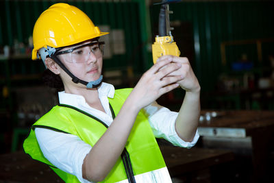 Midsection of man working with umbrella