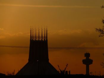 Silhouette of building at sunset