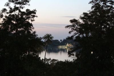 Scenic view of lake against sky at sunset