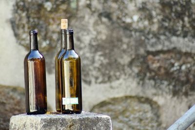 Close-up of bottle against rock