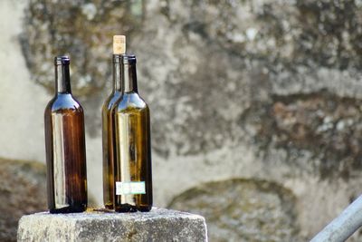 Close-up of bottles on rock