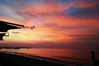 Scenic view of beach against sky during sunset