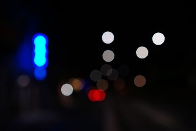 Defocused image of illuminated lights at night