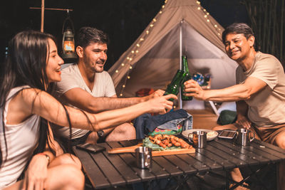 Group of people having food outdoors