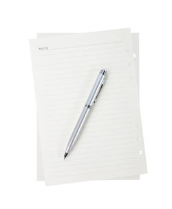 High angle view of pen on paper against white background