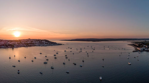 Scenic view of sea against clear sky during sunset