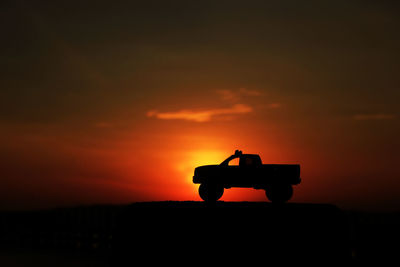 Silhouette of building at sunset