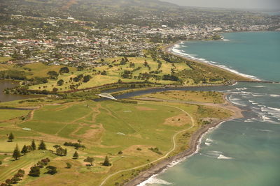 Aerial view of city by sea