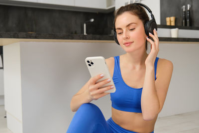 Young woman using mobile phone