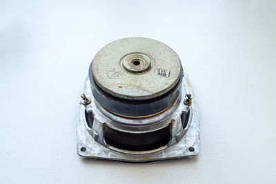 High angle view of old camera on table against white background