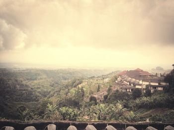 Scenic view of landscape against cloudy sky