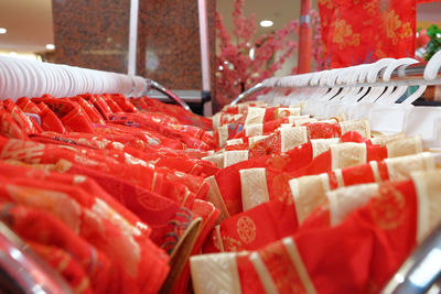 Close-up of red dresses for sale in store