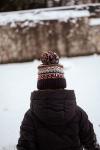 Child standing in the snow