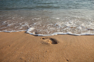 High angle view of surf on beach