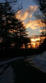 Snow covered landscape at sunset