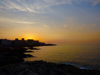 Scenic view of sea against sky during sunset