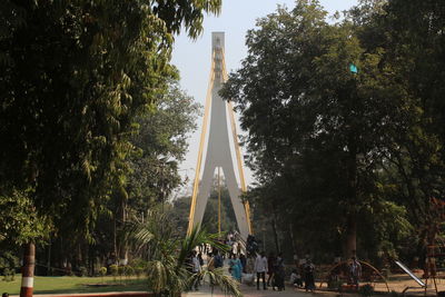 Palm trees in park against sky
