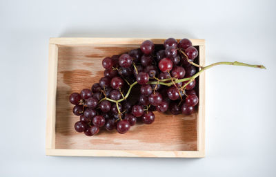 Directly above shot of grapes in plate on table