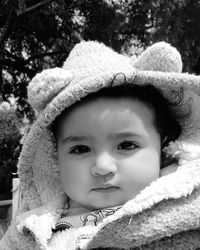 Portrait of cute baby boy in hood