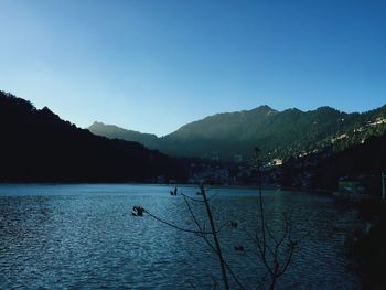 Scenic view of silhouette mountains against sky at sunset